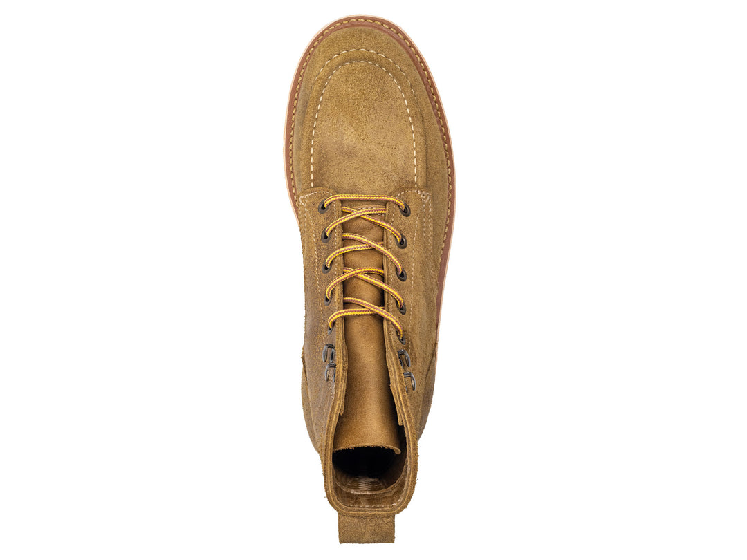 tan leather moc toe boot with yellow laces on a white background topdown view