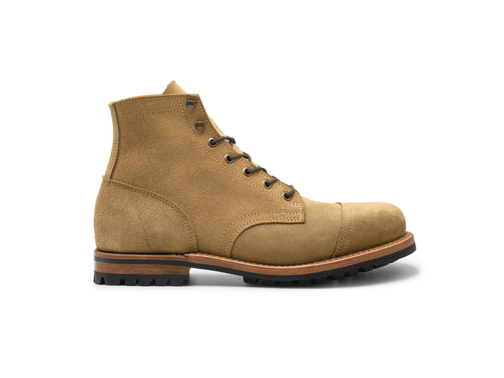 tan leather boot on a white background rotating 360° view
