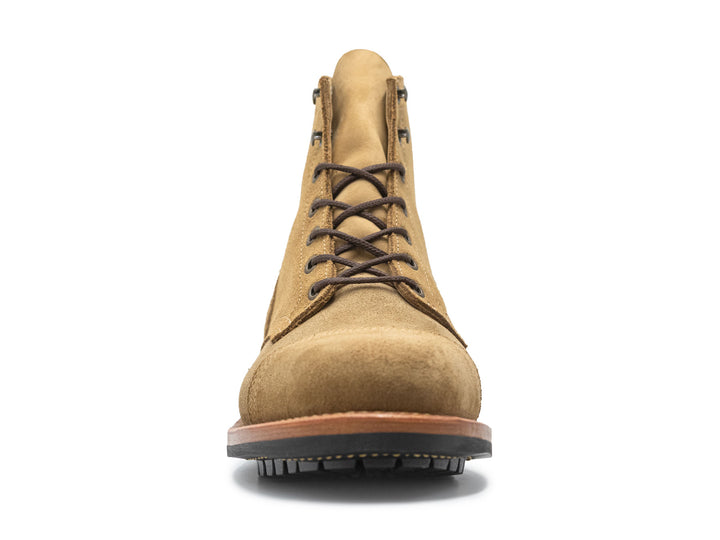 tan leather boot on a white background front view