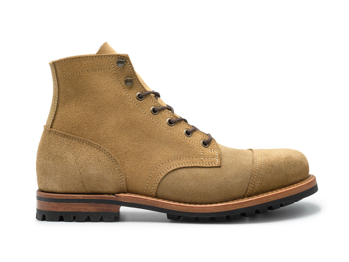 tan leather boot on a white background side view
