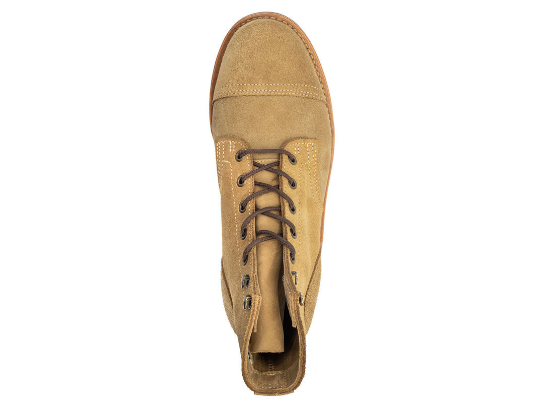 tan leather boot on a white background topdown view
