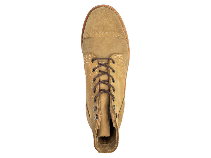 tan leather boot on a white background topdown view
