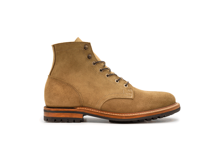 tan leather boot on a white background rotating 360° view