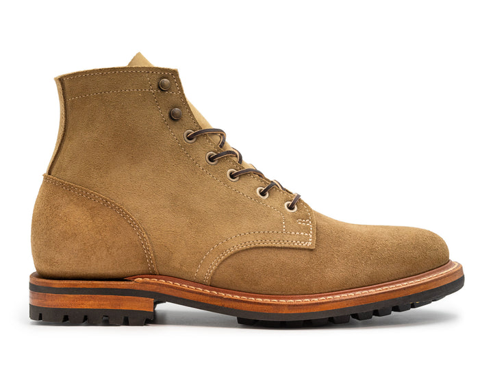 tan leather boot on a white background side view