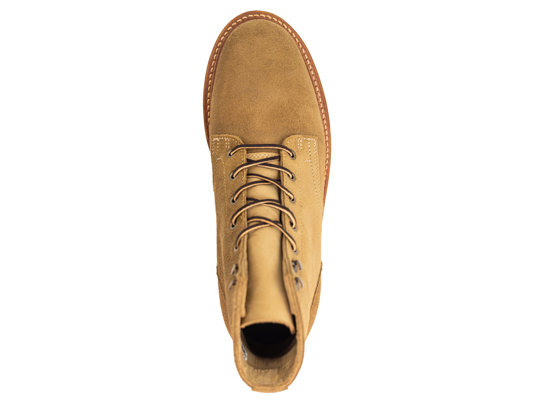 tan leather boot on a white background topdown view