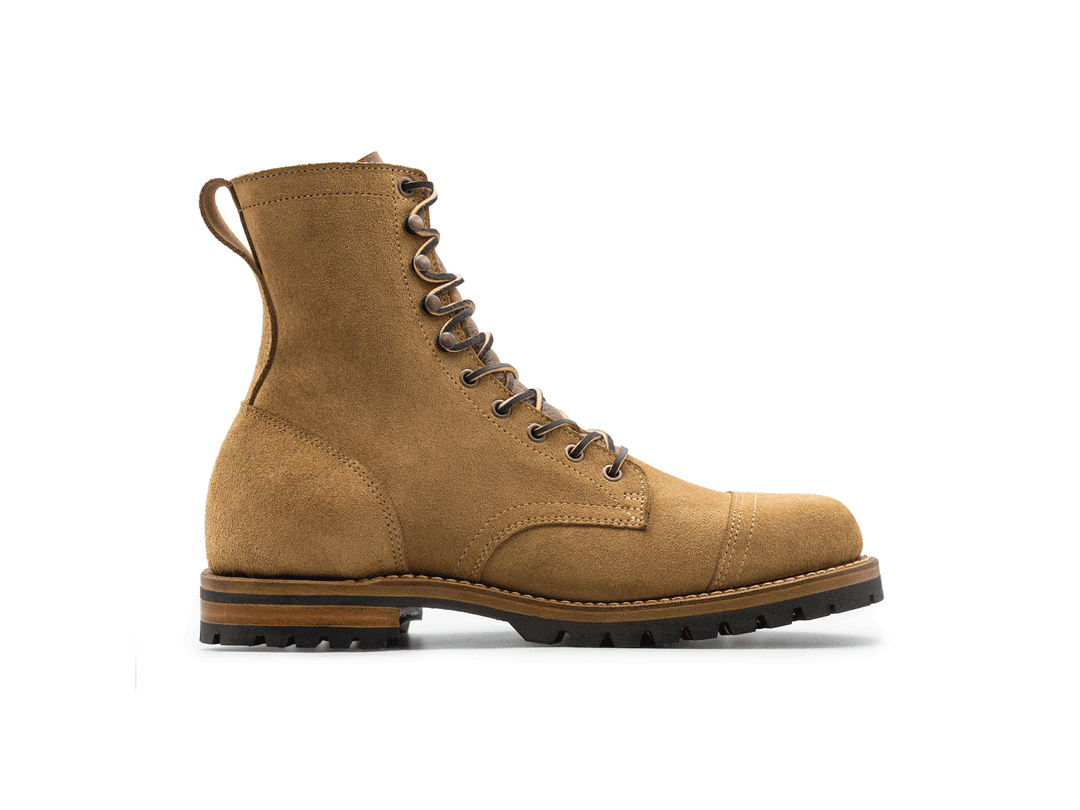 tan leather boot on a white background rotating 360° view