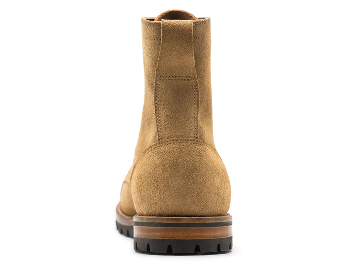 tan leather boot on a white background topdown view