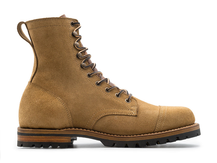 tan leather boot on a white background side view