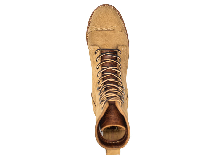 tan leather boot on a white background topdown view