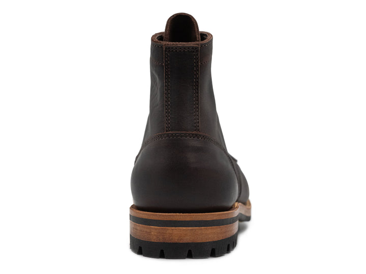 dark brown leather boot on a white background front view