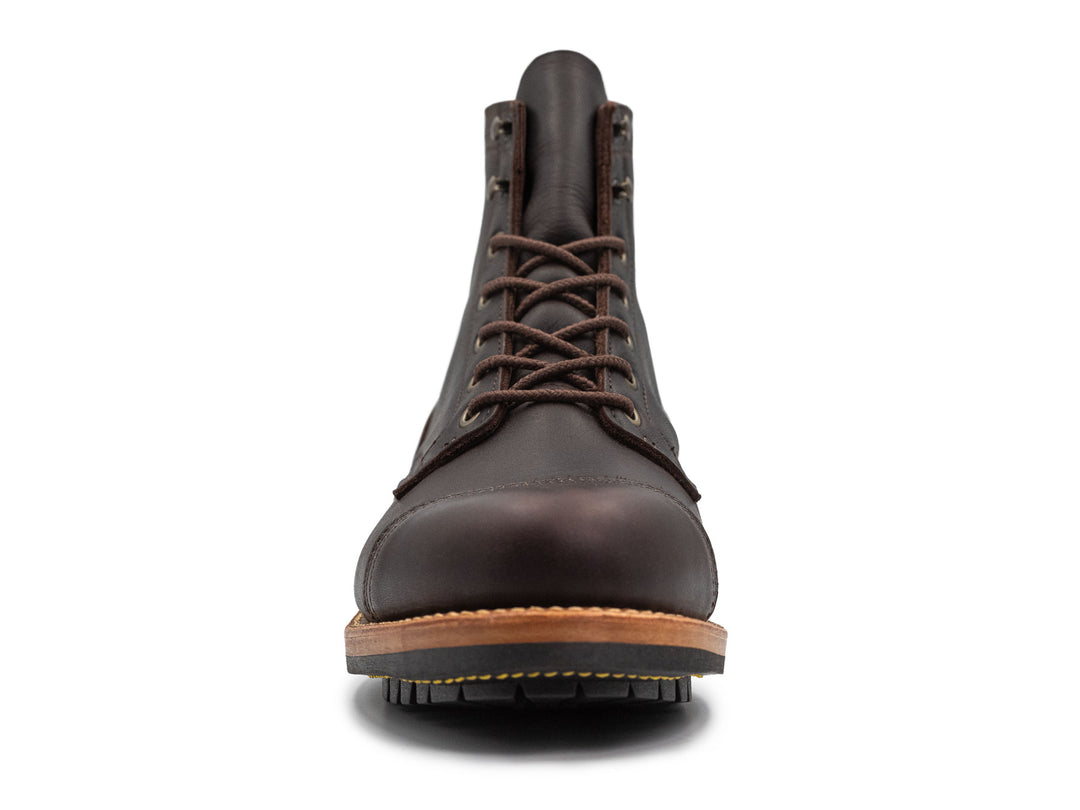 dark brown leather boot on a white background front view