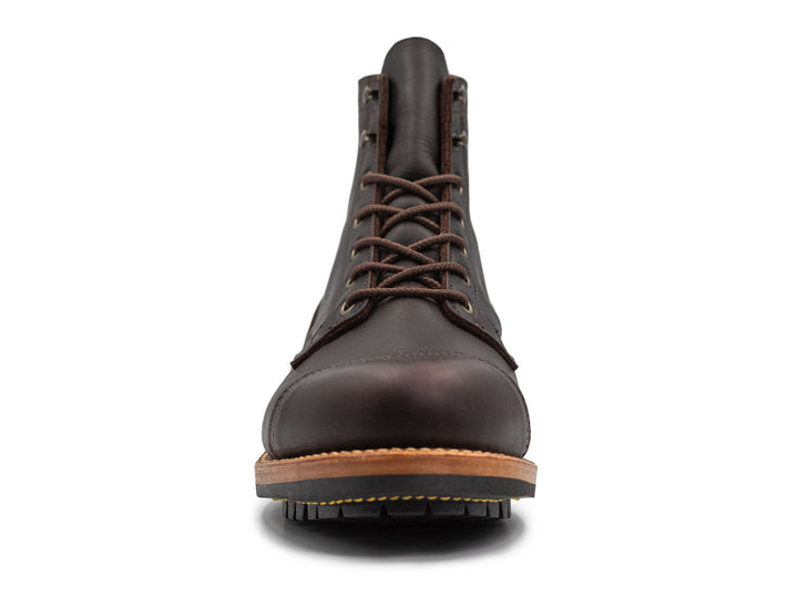dark brown leather boot on a white background front view