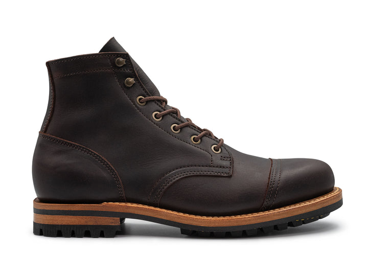 dark brown leather boot on a white background side view