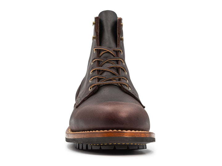 dark brown leather boot on a white background front view