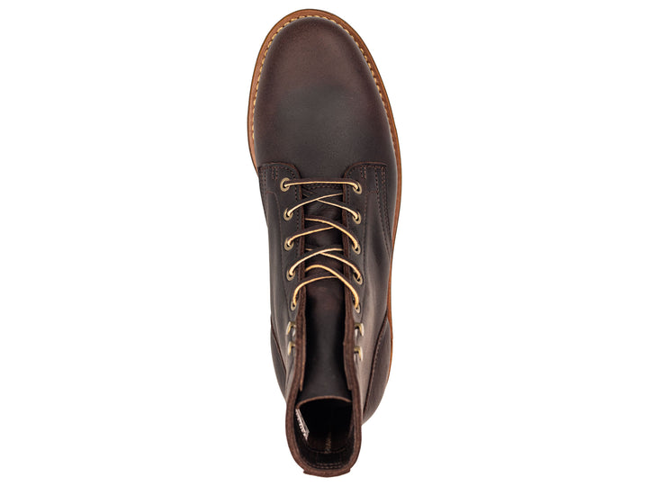 dark brown leather boot on a white background topdown view