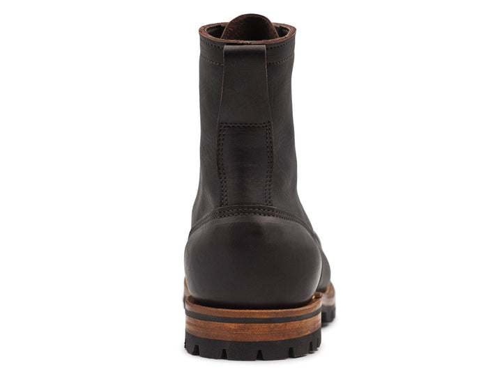dark brown leather boot on a white background view from behind