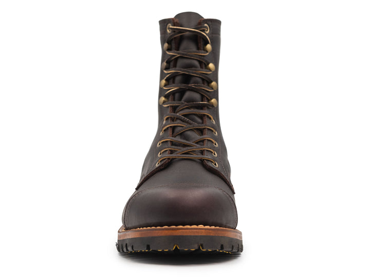 dark brown leather boot on a white background front view