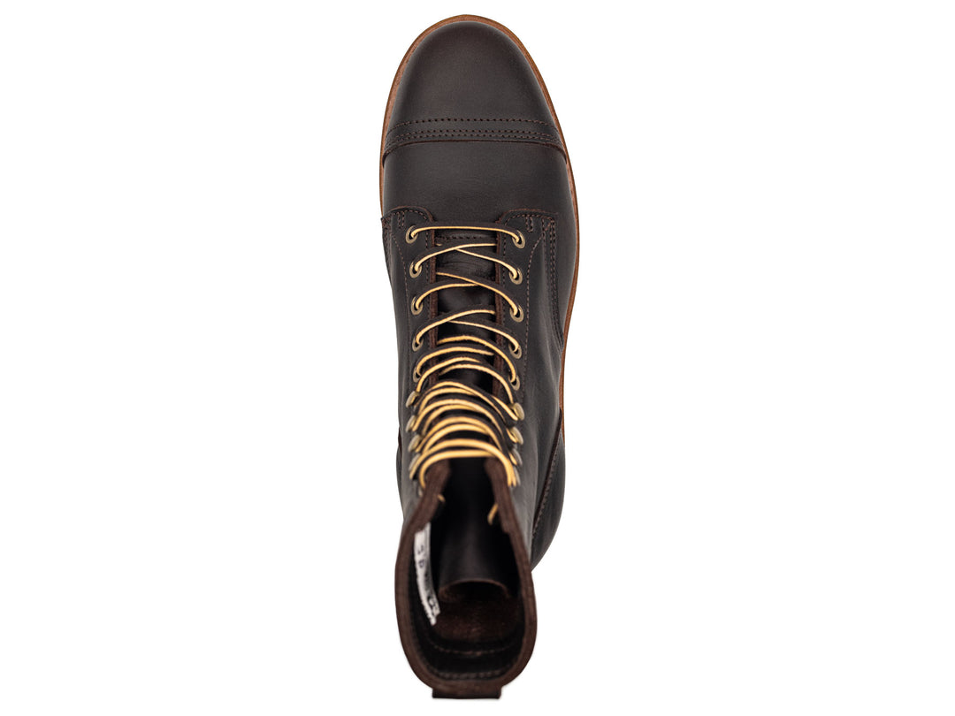 dark brown leather boot on a white background topdown view