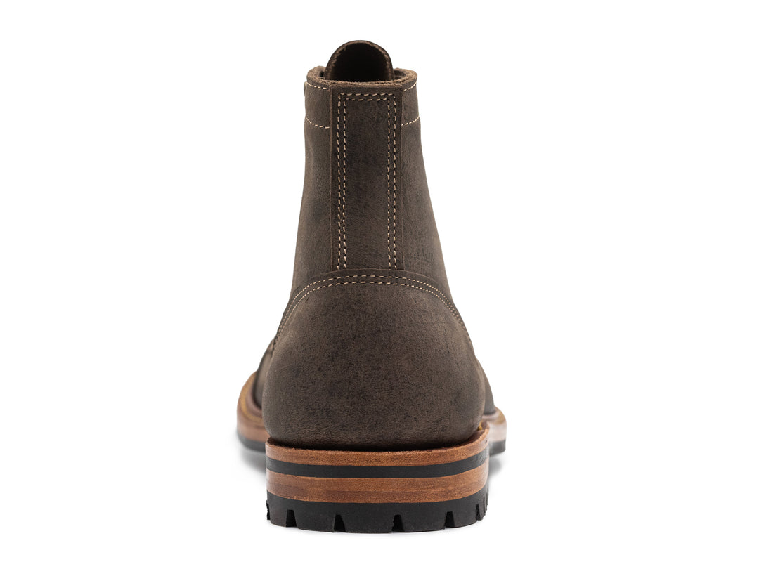 back view of gray leather boot on white background