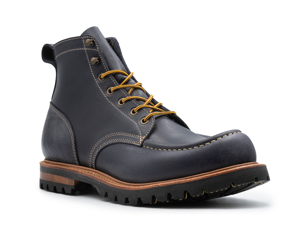 3qtr view of dark blue leather boot on white background