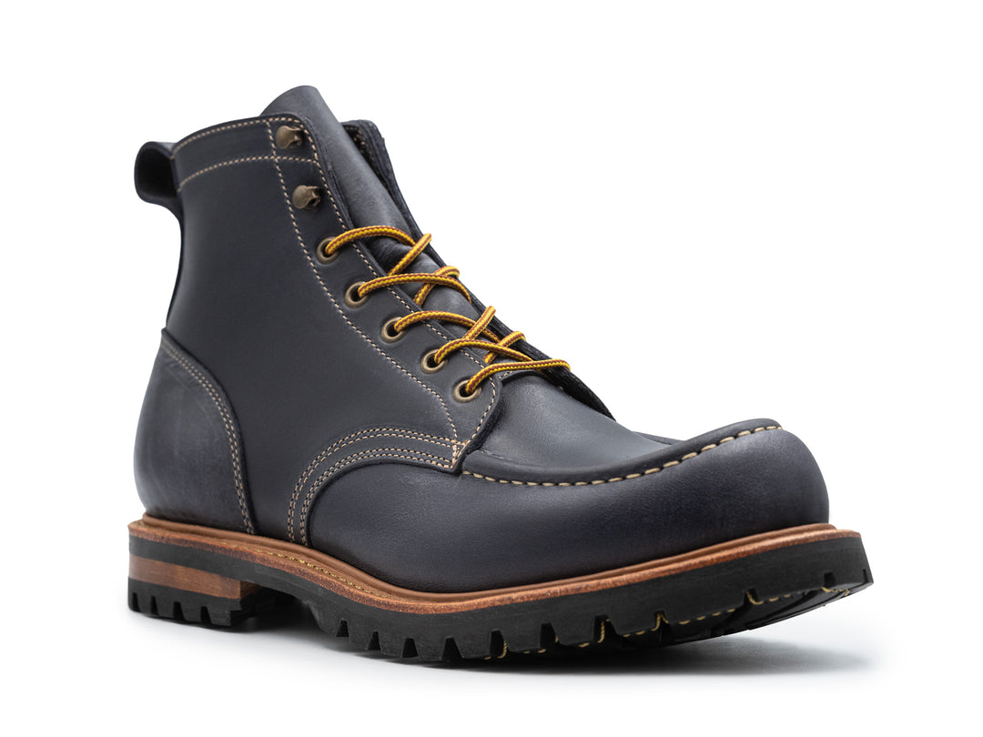 3qtr view of dark blue leather boot on white background