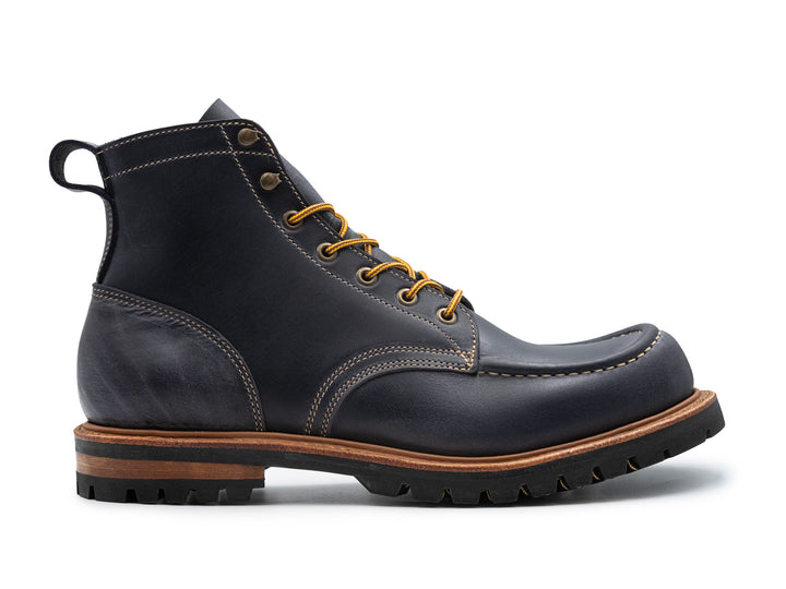 dark blue leather boot on white background