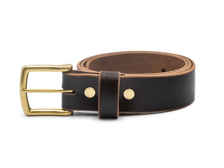brown leather belt coiled with brass buckle