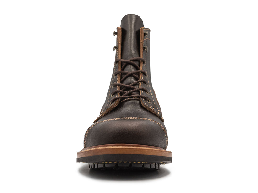dark brown leather boot on a white background front view