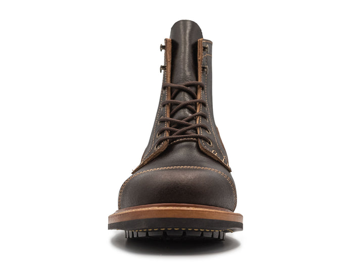dark brown leather boot on a white background front view