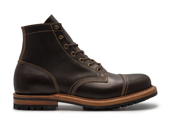 dark brown leather boot on a white background side view