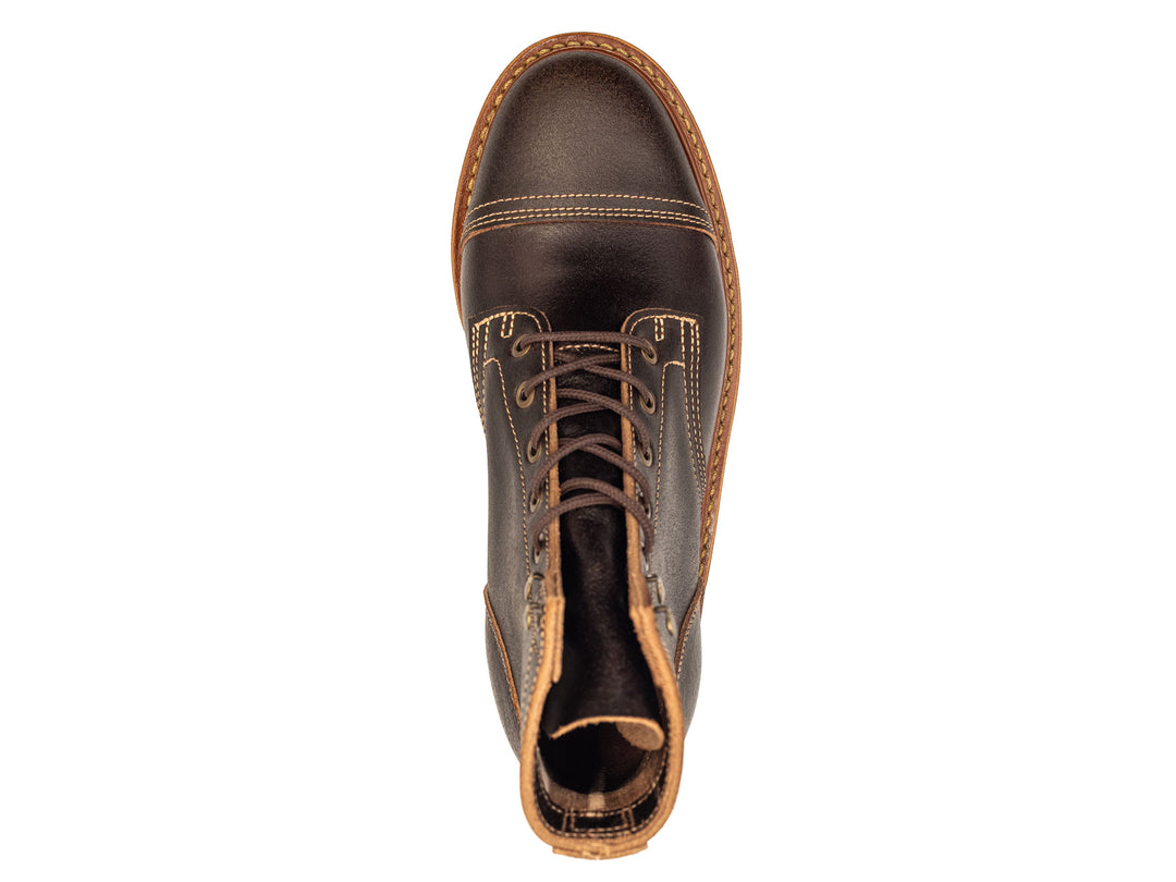 dark brown leather boot on a white background topdown view