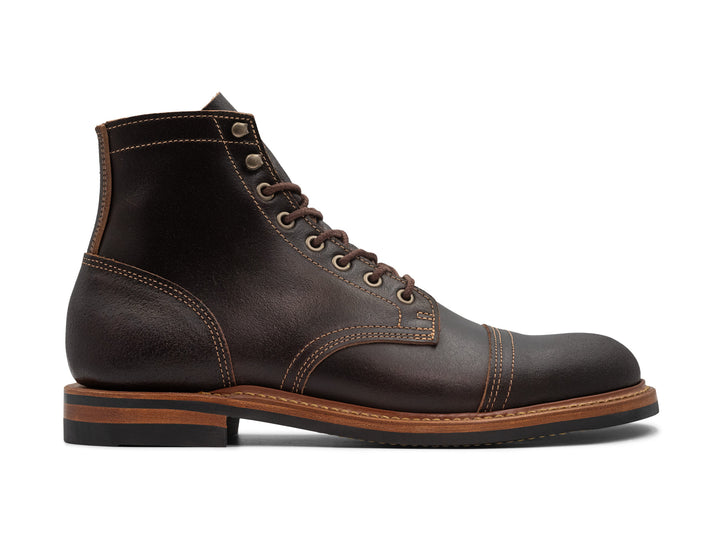 side view of java waxed leather boot on white background