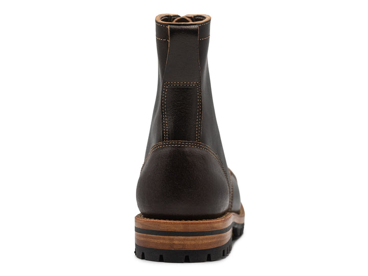 dark brown leather boot on a white background view from behind