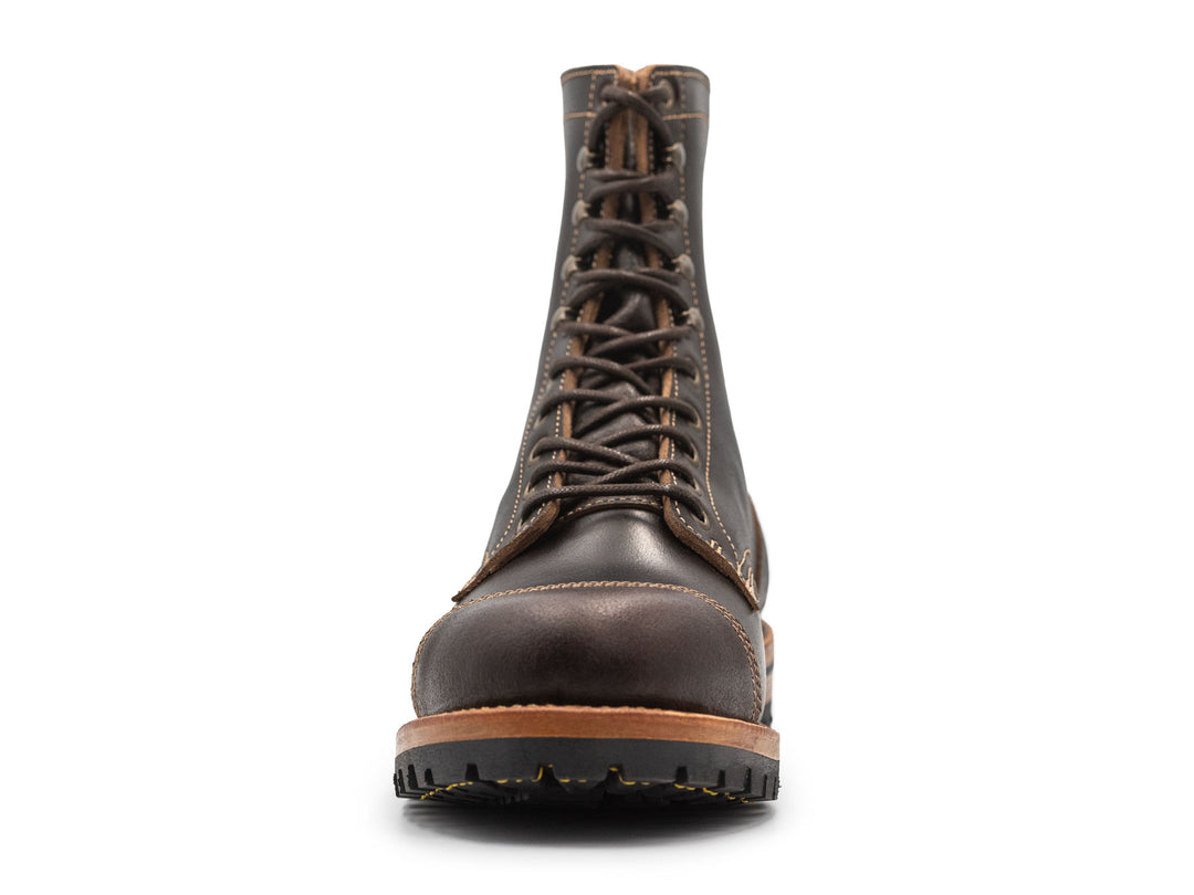 dark brown leather boot on a white background front view