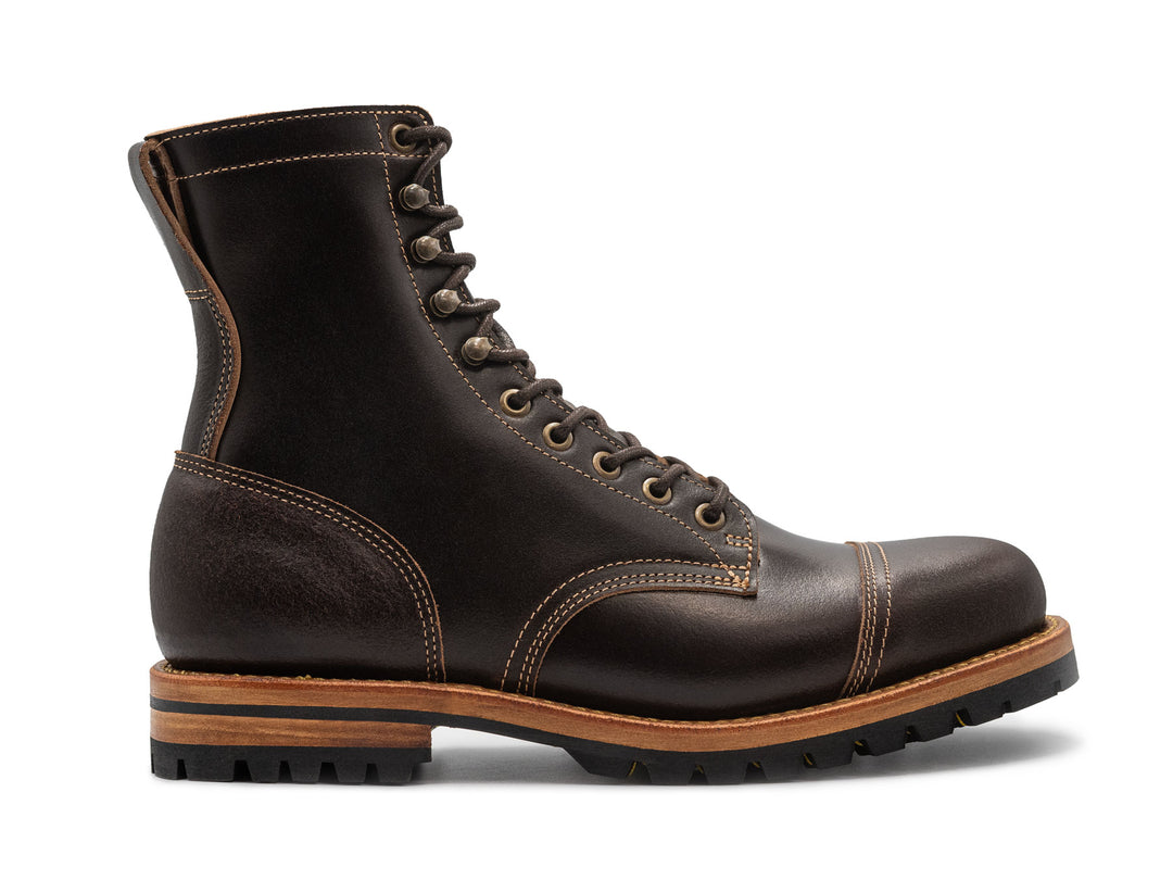 brown tall leather boot side view on white background