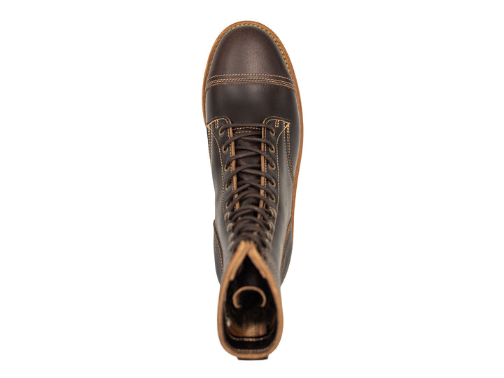 dark brown leather boot on a white background topdown view