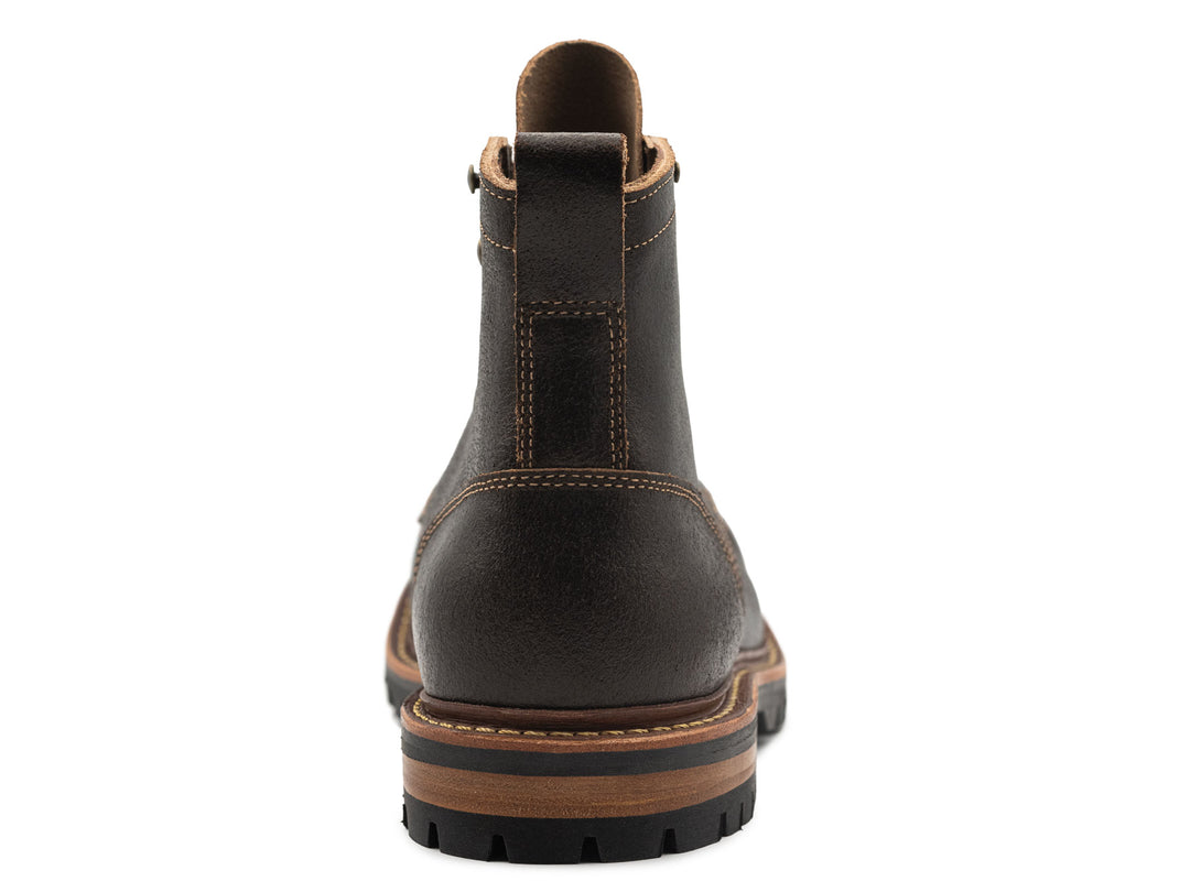 dark brown leather boot on a white background view from behind