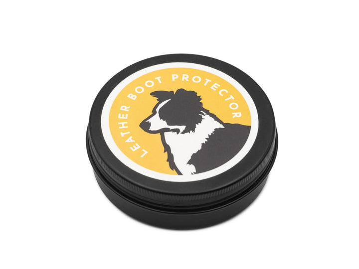 Round leather boot protector with a dog illustration on a white background