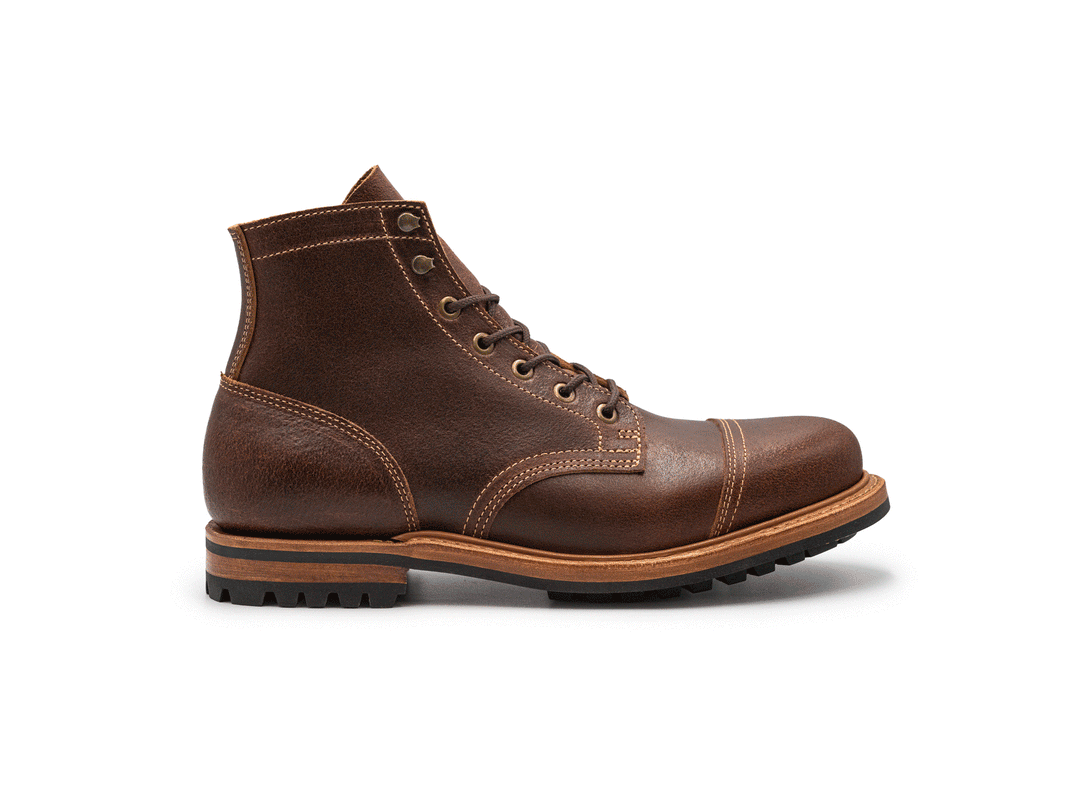 brown leather cap toe boot on a white background rotating 360° view