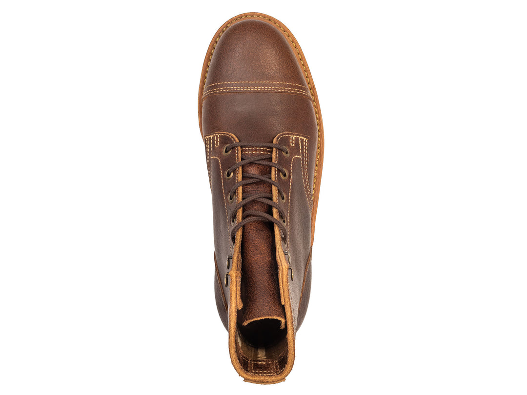 brown leather cap toe boot on a white background topdown view