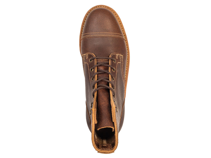 brown leather cap toe boot on a white background topdown view