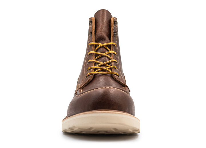 Brown leather moc toe boot with yellow laces on a white background front view