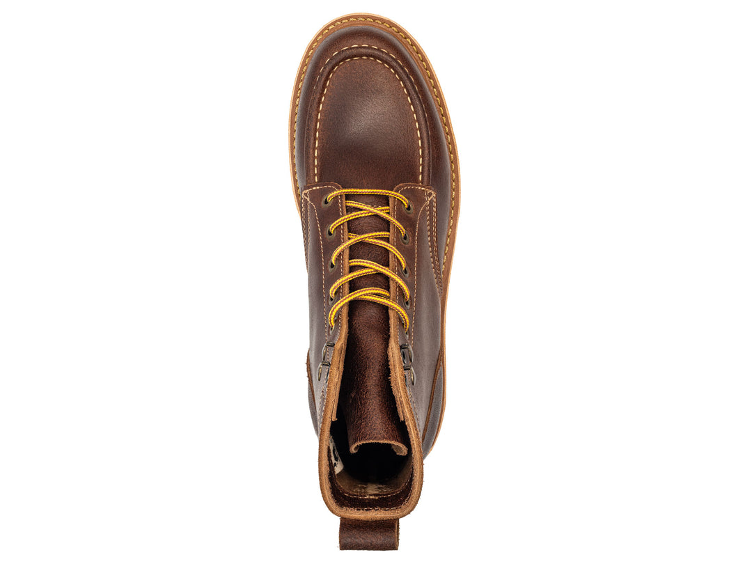 Brown leather moc toe boot with yellow laces on a white background topdown view