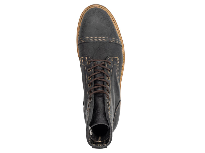 topdown view of gray textured leather boot on white background