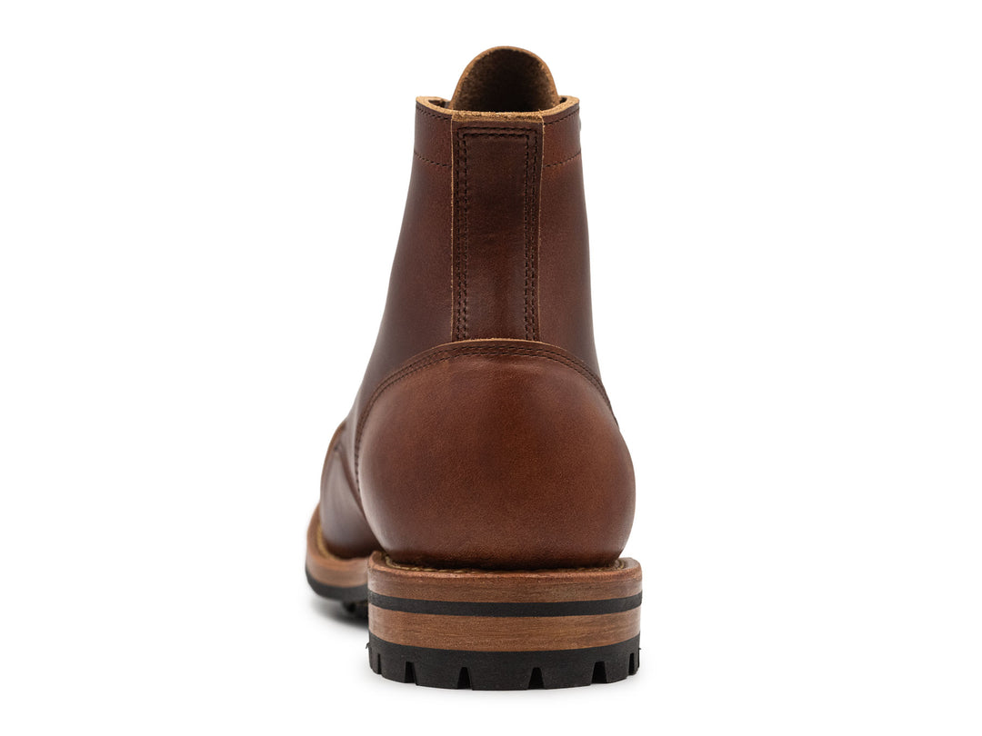 auburn brown leather boot on a white background back view