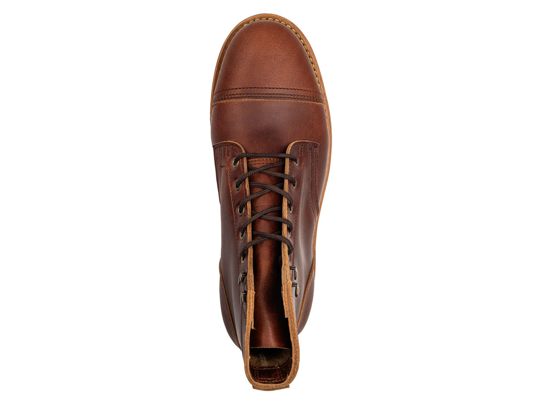 auburn brown leather boot on a white background topdown view