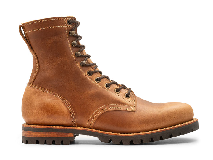 tan leather boot on a white background side view