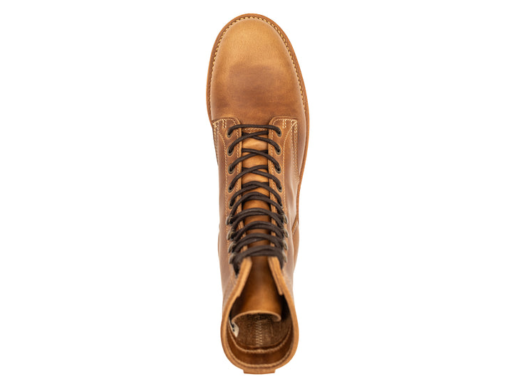 tan leather boot on a white background topdown view