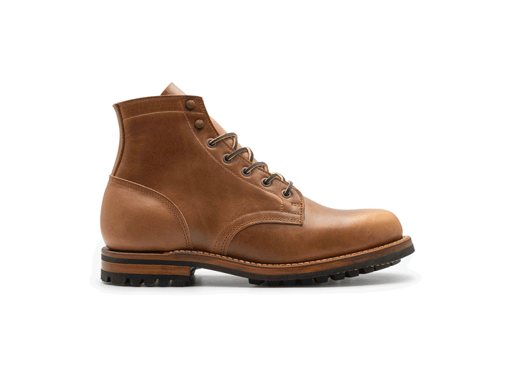 tan leather boot on a white background rotating 360° view