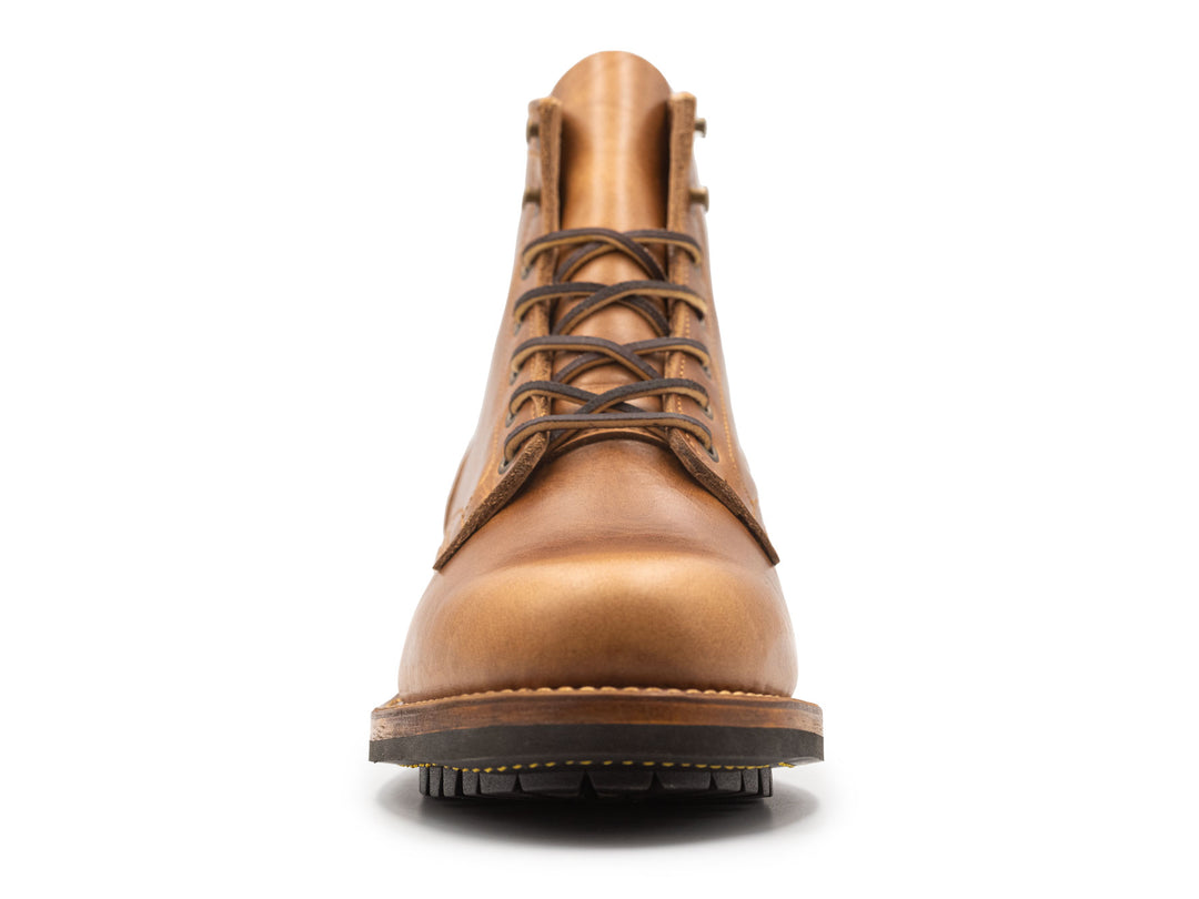 tan leather boot on a white background front view